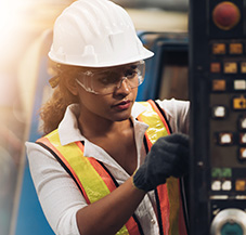 woman engineer in hardhat and goggles